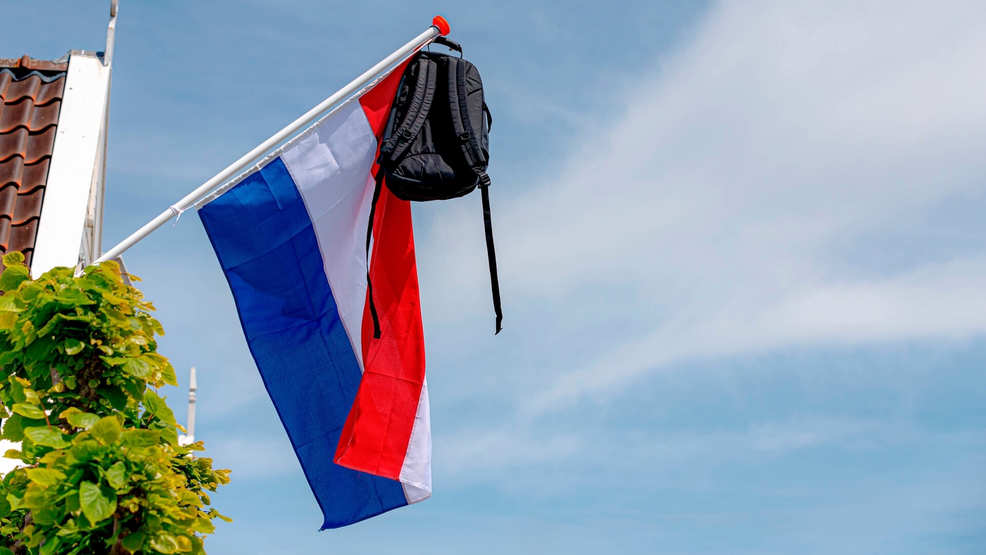 geslaagd. tas aan vlag